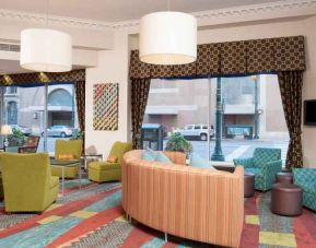 Comfortable lobby workspace with lounges at the Hampton Inn Indianapolis Dwtn Across from Circle Centre.