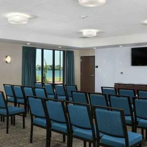 Meeting room with tables and screen at the Hampton Inn Burley.