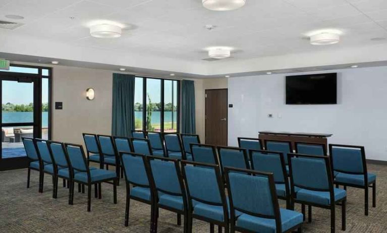 Meeting room with tables and screen at the Hampton Inn Burley.