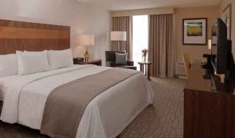 King guestroom with desk and TV screen at the DoubleTree by Hilton Pittsburgh Green Tree.