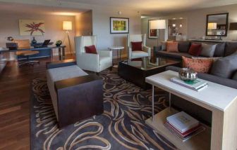 Spacious presidential suite with working station at the DoubleTree by Hilton Pittsburgh Green Tree.