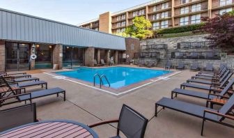 Outdoor pool with lounges at the DoubleTree by Hilton Pittsburgh Green Tree.