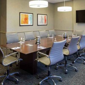 Small meeting room with TV screen at the DoubleTree by Hilton Pittsburgh Green Tree.