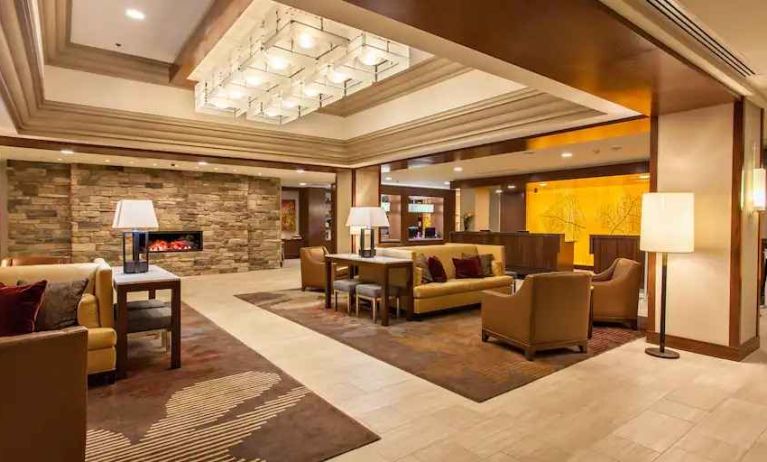 Elegant lobby workspace with sofas and fireplace at the DoubleTree by Hilton Pittsburgh Green Tree.