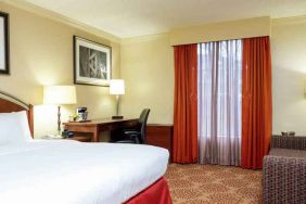 Desk and sofa in a king bedroom at the DoubleTree by Hilton Grand Rapids Airport.