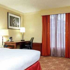 Desk and sofa in a king bedroom at the DoubleTree by Hilton Grand Rapids Airport.