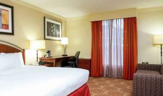 Desk and sofa in a king bedroom at the DoubleTree by Hilton Grand Rapids Airport.