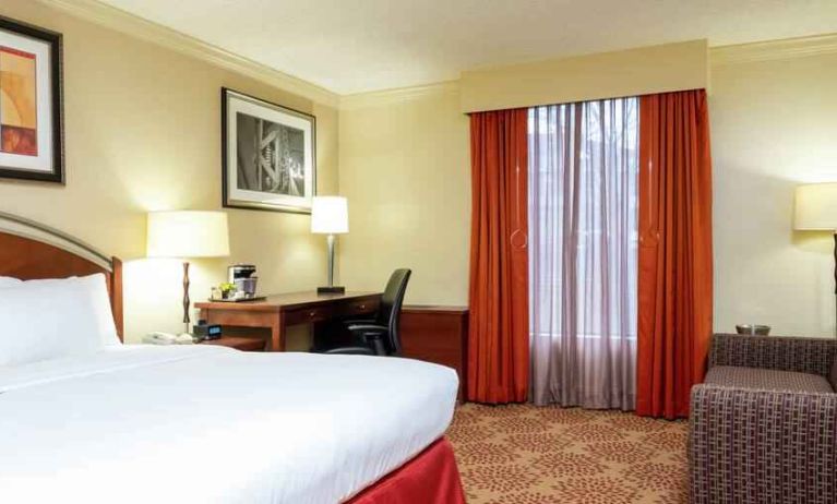 Desk and sofa in a king bedroom at the DoubleTree by Hilton Grand Rapids Airport.