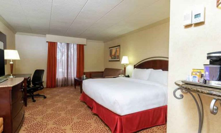 Spacious king guestroom with king size bed at the DoubleTree by Hilton Grand Rapids Airport.