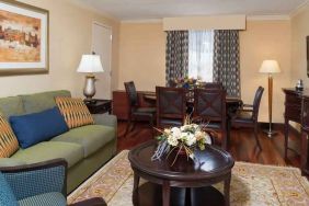 Living room with working station at the DoubleTree by Hilton Grand Rapids Airport.