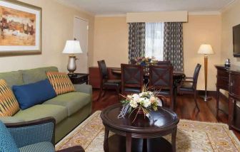 Living room with working station at the DoubleTree by Hilton Grand Rapids Airport.