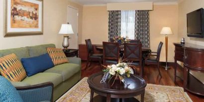 Living room with working station at the DoubleTree by Hilton Grand Rapids Airport.