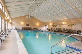 Indoor pool with lounges at the DoubleTree by Hilton Grand Rapids Airport.