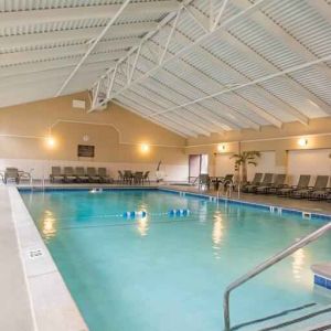 Indoor pool with lounges at the DoubleTree by Hilton Grand Rapids Airport.