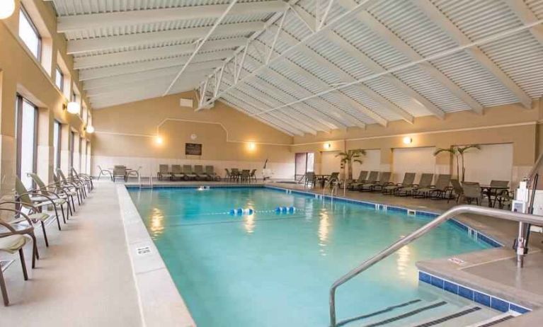 Indoor pool with lounges at the DoubleTree by Hilton Grand Rapids Airport.