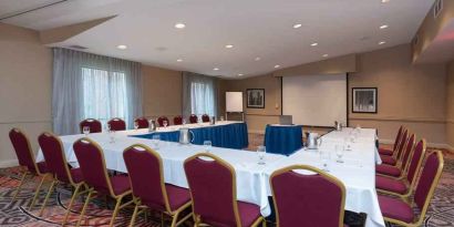 Meeting room with u shape table at the DoubleTree by Hilton Grand Rapids Airport.