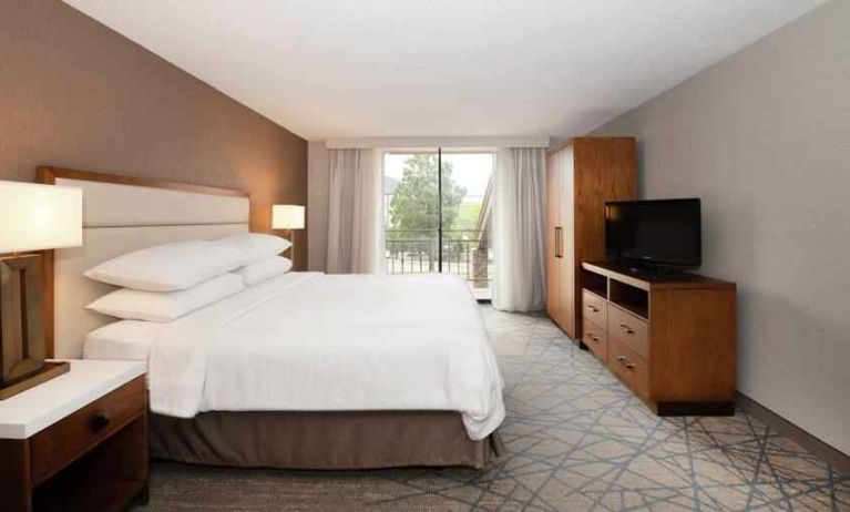 Bright king guestroom at the Embassy Suites by Hilton Colorado Springs.