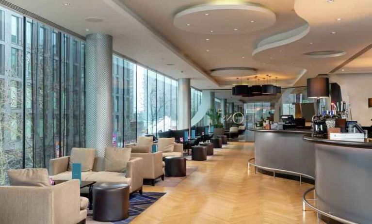 Comfortable lobby workspace with sofas at the Hilton London Wembley.