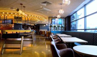 Elegant restaurant area with tables and chairs at the DoubleTree by Hilton Coventry Building Society Arena.