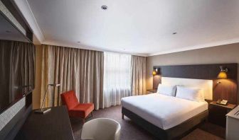 King guestroom with working station at the DoubleTree by Hilton London - Ealing.