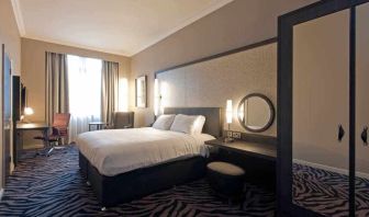 Deluxe room with king size bed at the DoubleTree by Hilton Edinburgh City Centre.