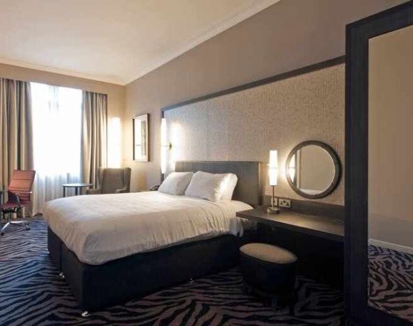 Deluxe room with king size bed at the DoubleTree by Hilton Edinburgh City Centre.