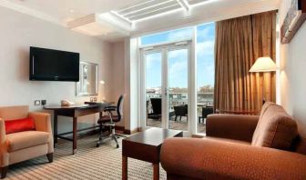 Bright living room in a hotel suite at the Hilton London Paddington.