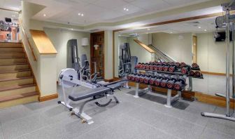 Fitness center with weights at the Hilton London Paddington.