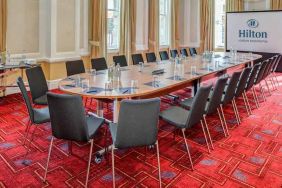 Meeting room with large screen at the Hilton London Paddington.