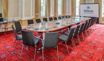 Meeting room with large screen at the Hilton London Paddington.