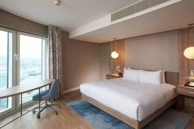 comfortable king room with work desk and lots of natural light at DoubleTree by Hilton London ExCel.