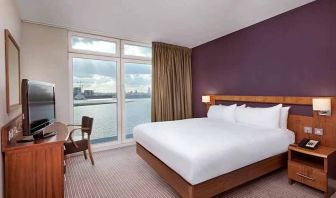 beautiful delux king room with TV and work area at DoubleTree by Hilton London ExCel.