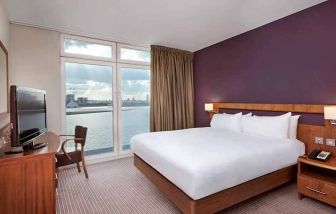 beautiful delux king room with TV and work area at DoubleTree by Hilton London ExCel.