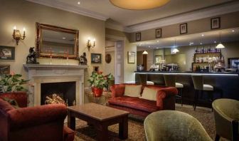 Elegant lobby workspace by the fireplace at the Hilton London Euston.