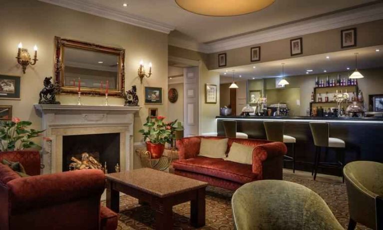 Elegant lobby workspace by the fireplace at the Hilton London Euston.