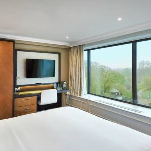 King guestroom with window and desk at the DoubleTree by Hilton London - Hyde Park.