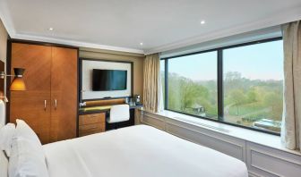 King guestroom with window and desk at the DoubleTree by Hilton London - Hyde Park.