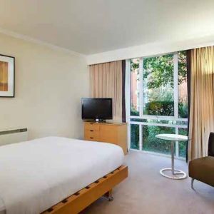 Hotel room with desk overlooking the garden at the Hilton Northampton.