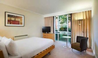 Hotel room with desk overlooking the garden at the Hilton Northampton.