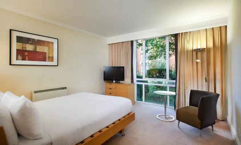 Hotel room with desk overlooking the garden at the Hilton Northampton.