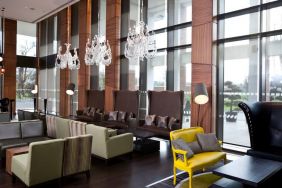 Stylish lobby workspace with sofas at the Hilton London Heathrow Airport Terminal 5.