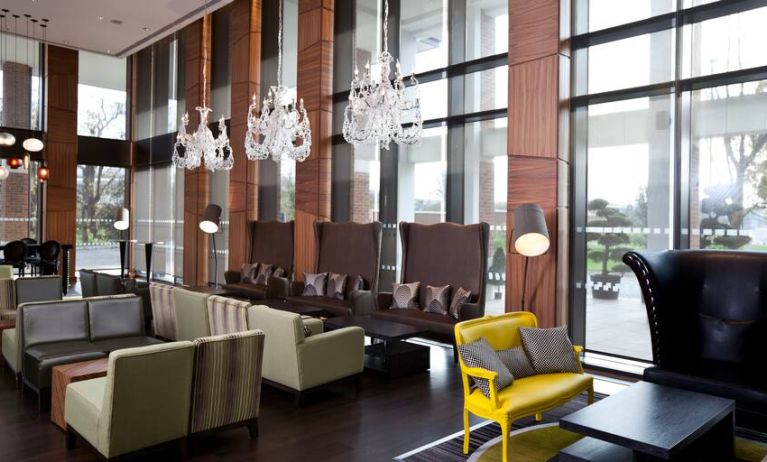 Stylish lobby workspace with sofas at the Hilton London Heathrow Airport Terminal 5.