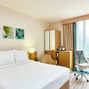 King bedroom with desk and window at the Hilton Garden Inn Birmingham Brindleyplace.