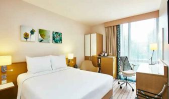 King bedroom with desk and window at the Hilton Garden Inn Birmingham Brindleyplace.