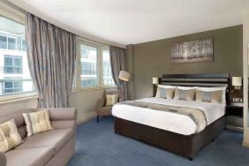 Spacious king suite with sofa at the DoubleTree by Hilton London - Chelsea.