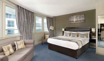 Spacious king suite with sofa at the DoubleTree by Hilton London - Chelsea.