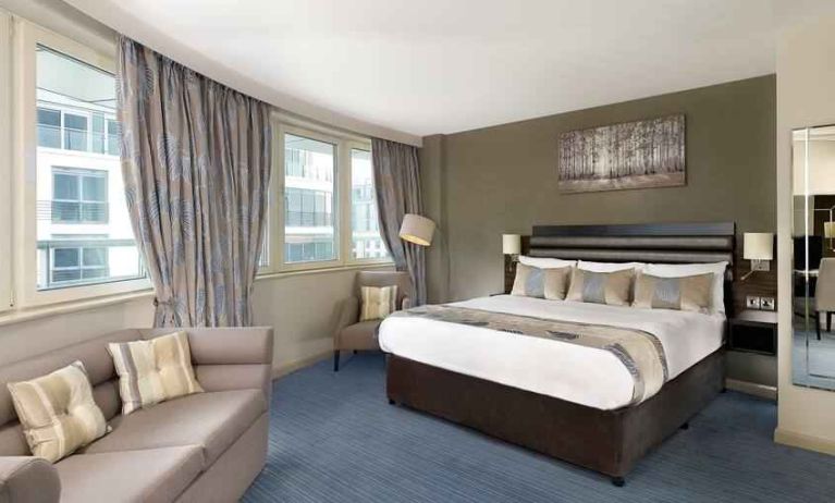 Spacious king suite with sofa at the DoubleTree by Hilton London - Chelsea.