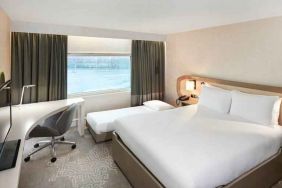 Queen room with pullout single bed at the Hilton London Heathrow Airport.