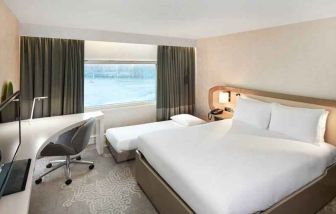 Queen room with pullout single bed at the Hilton London Heathrow Airport.