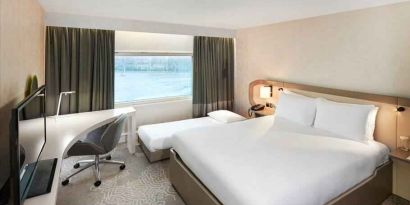 Queen room with pullout single bed at the Hilton London Heathrow Airport.